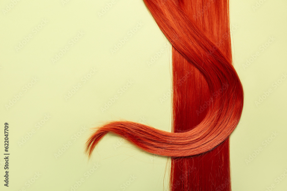 Beautiful ginger hair on green background, closeup