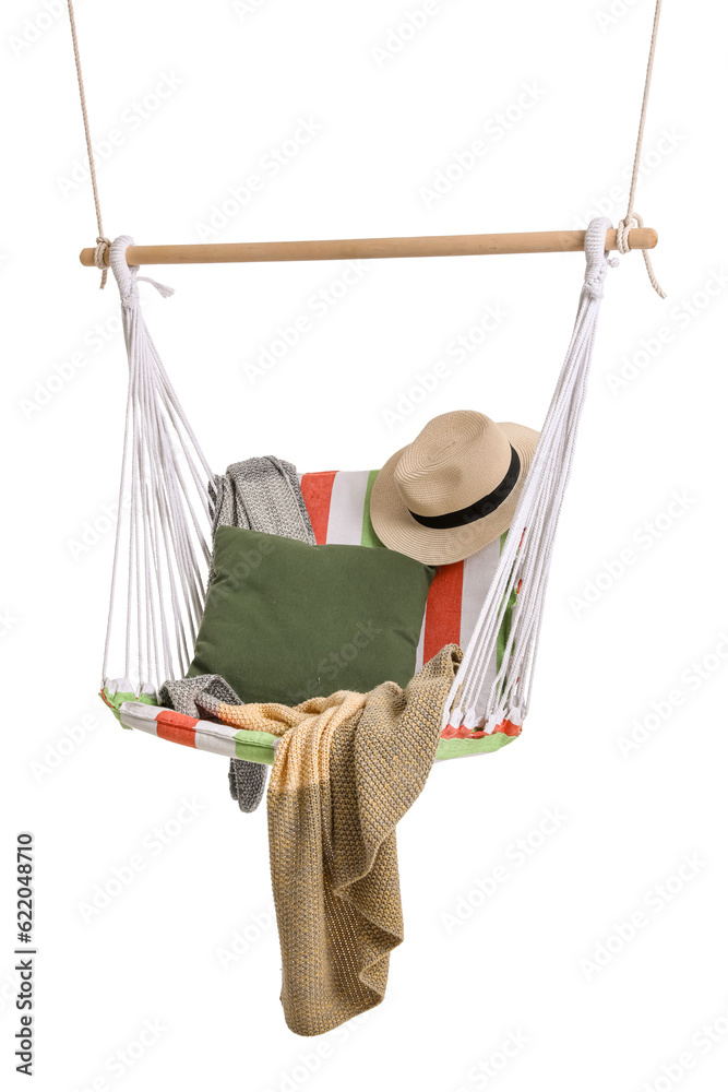 Cozy striped hammock with cushion, plaid and hat isolated on white background