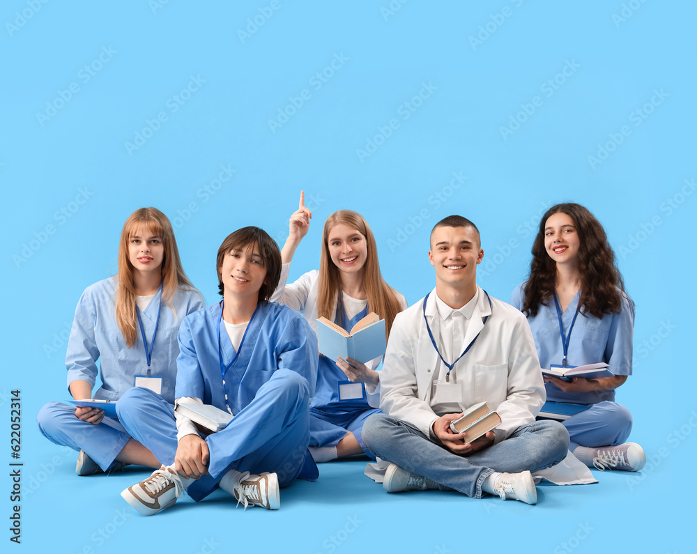 Group of medical students on blue background