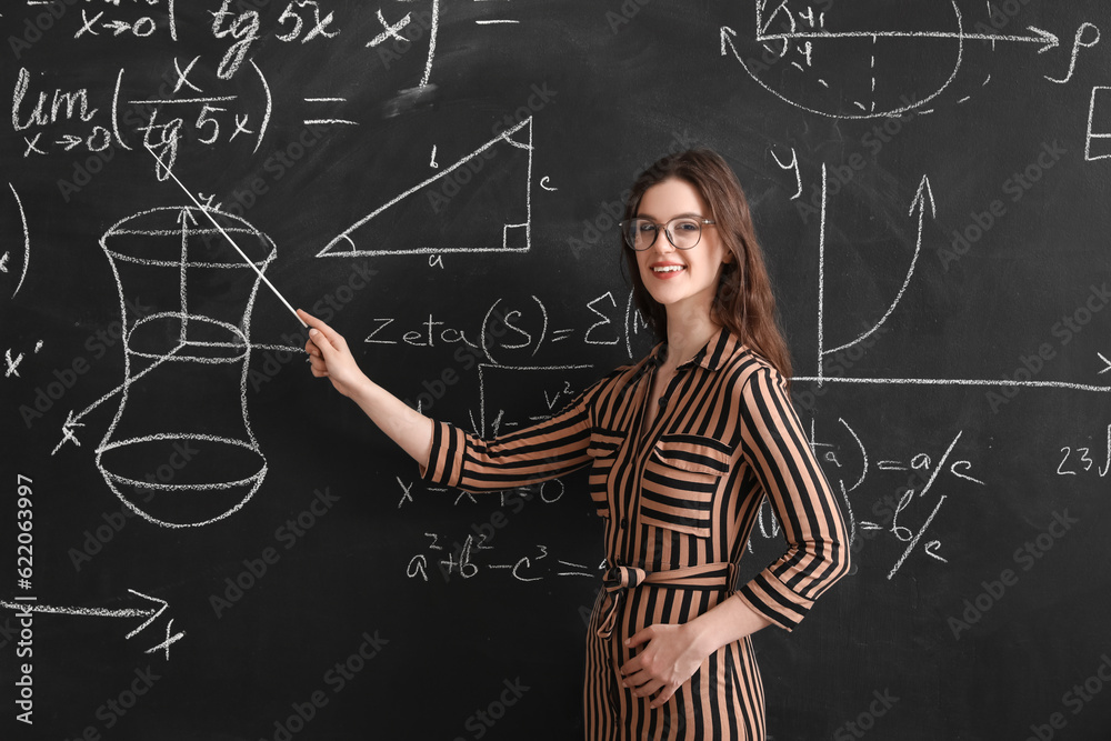 Female Math teacher conducting lesson in classroom