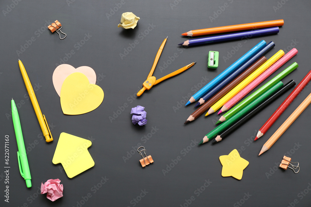 Calculator with different stationery on black chalkboard