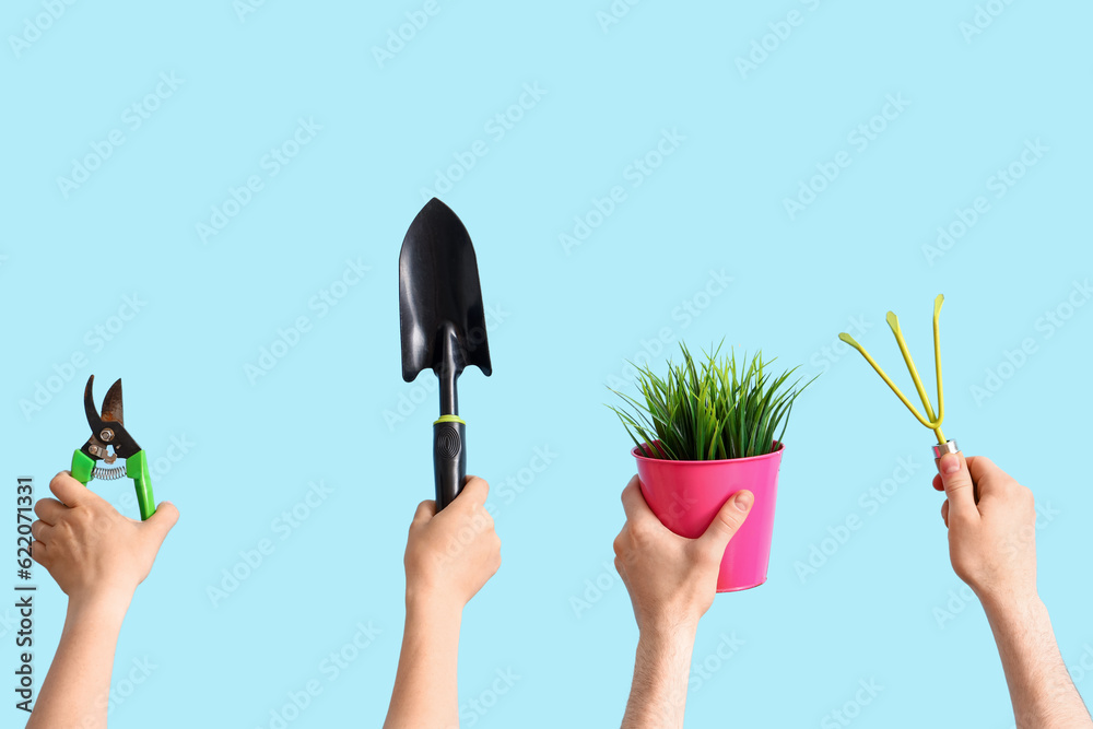 People with gardening tools and grass on blue background