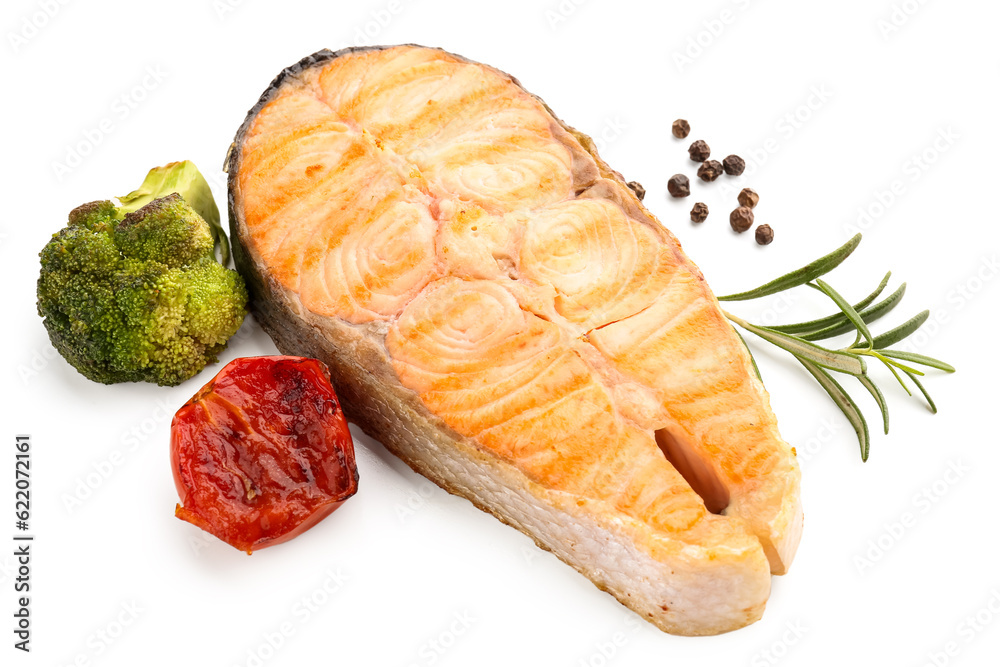 Tasty grilled salmon steak and vegetables on white background