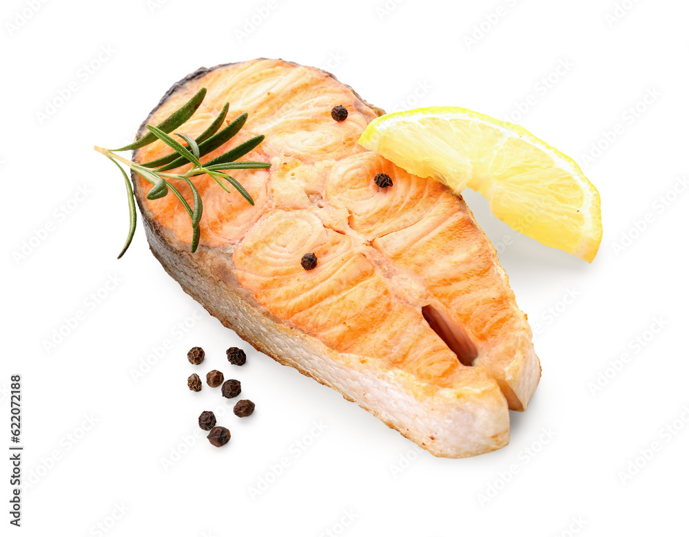 Tasty grilled salmon steak with lemon on white background