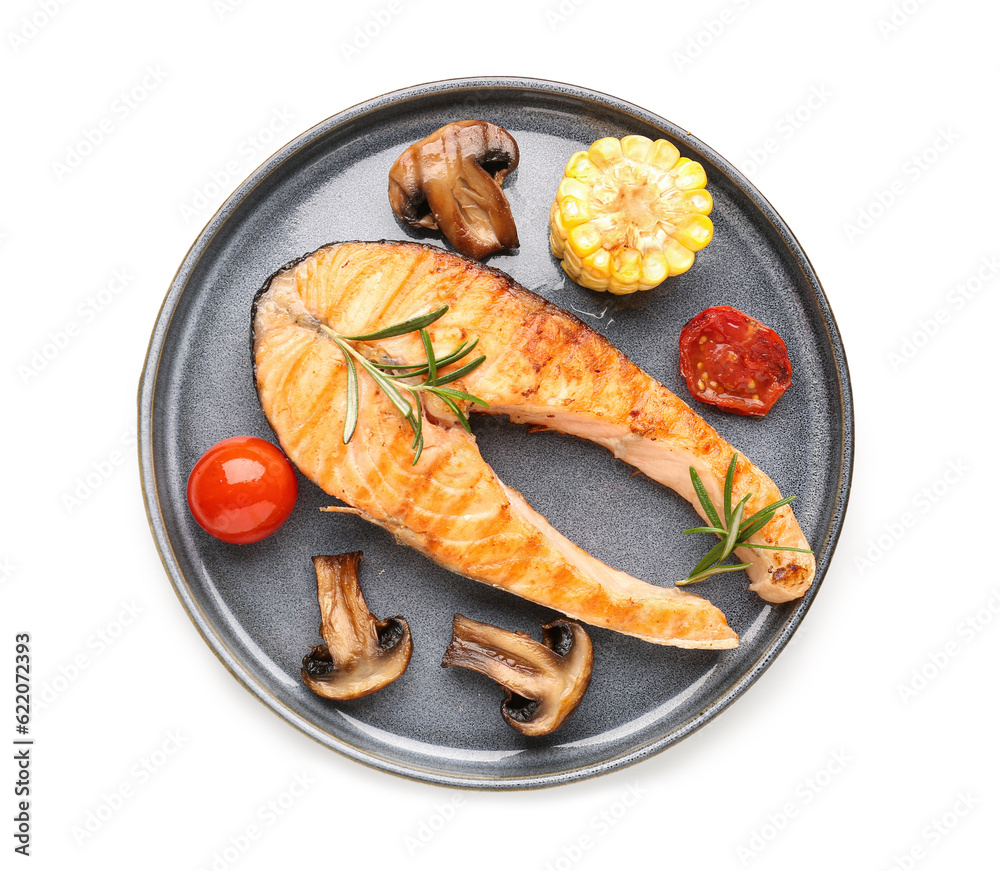 Plate with tasty grilled salmon steak and vegetables on white background