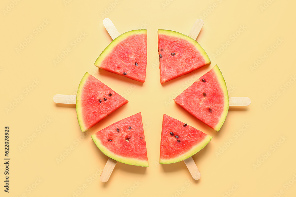 Frame made of sweet watermelon sticks on yellow background