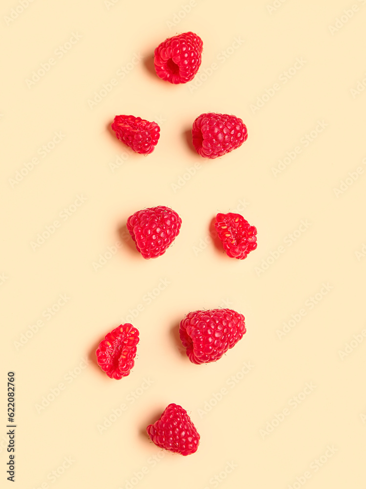 Fresh raspberries on yellow background