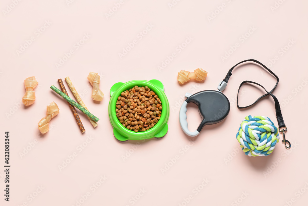 Composition with dog food and accessories on light background