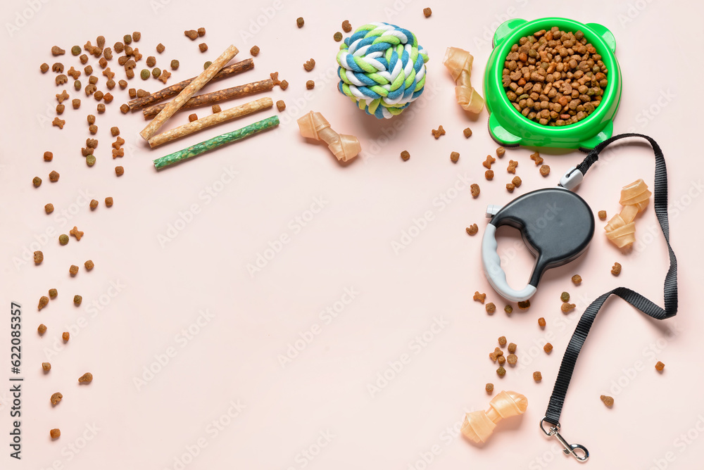 Composition with dog food and accessories on light background