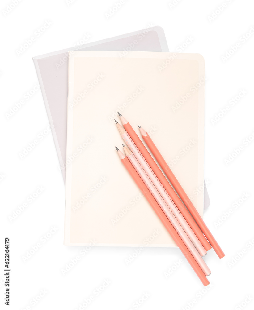 Different notebooks with pencils isolated on white background