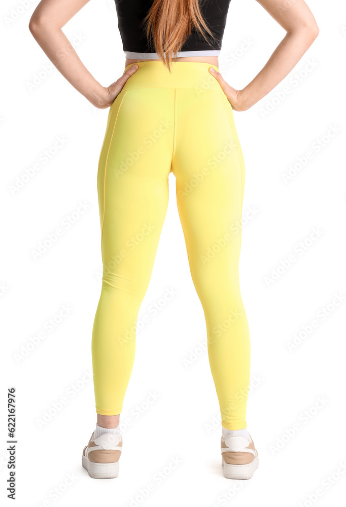 Sporty young woman in leggings on  white background, back view