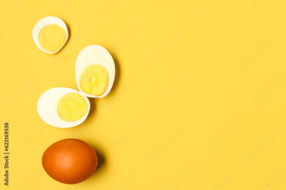 Tasty boiled eggs on yellow background