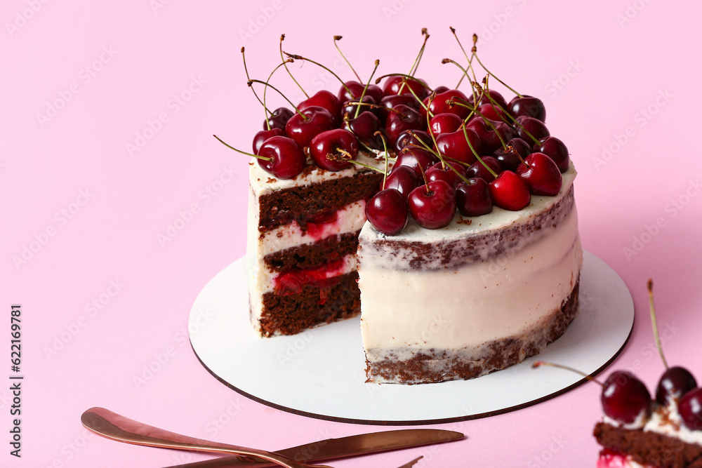 Tasty cherry cake on pink background