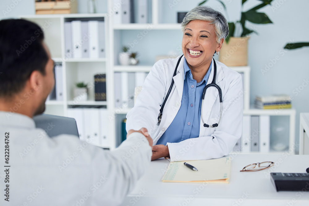 Happy woman, doctor and handshake for meeting, hiring or partnership in consultation at the hospital