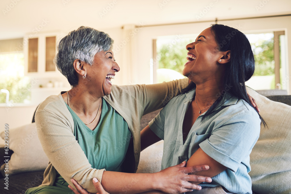 Funny, senior mother and hug daughter in home, bonding and laughing together. Happy, elderly mom and