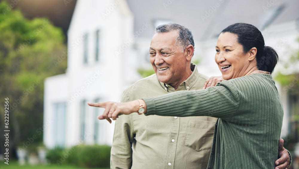 Happy, pointing and a senior couple in nature for a holiday, travel or break in retirement. Smile, l