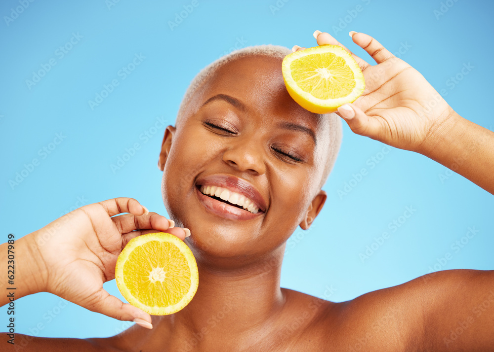 Orange, face and nutrition with a model black woman in studio on a blue background for treatment. Be