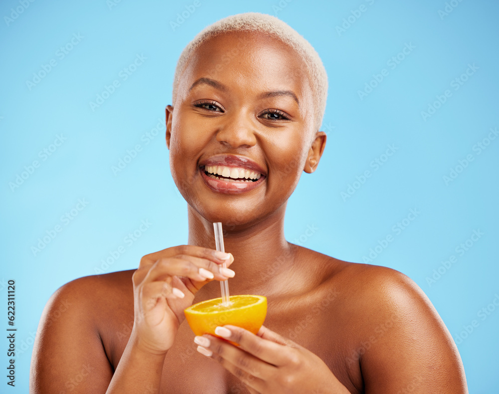 Happy black woman, portrait and orange for vitamin C, diet or natural nutrition against a blue studi