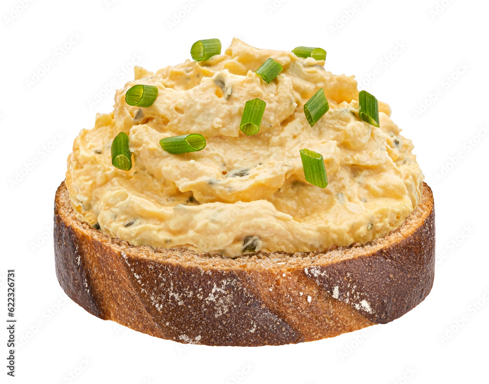 Egg spread with onion and chives on rye bread isolated on white background