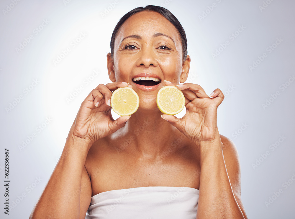 Portrait, orange and senior woman with skincare, dermatology and self care against a studio backgrou