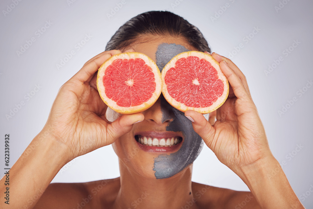 Hands with grapefruit, skincare and face mask with clay, charcoal or natural beauty product for well