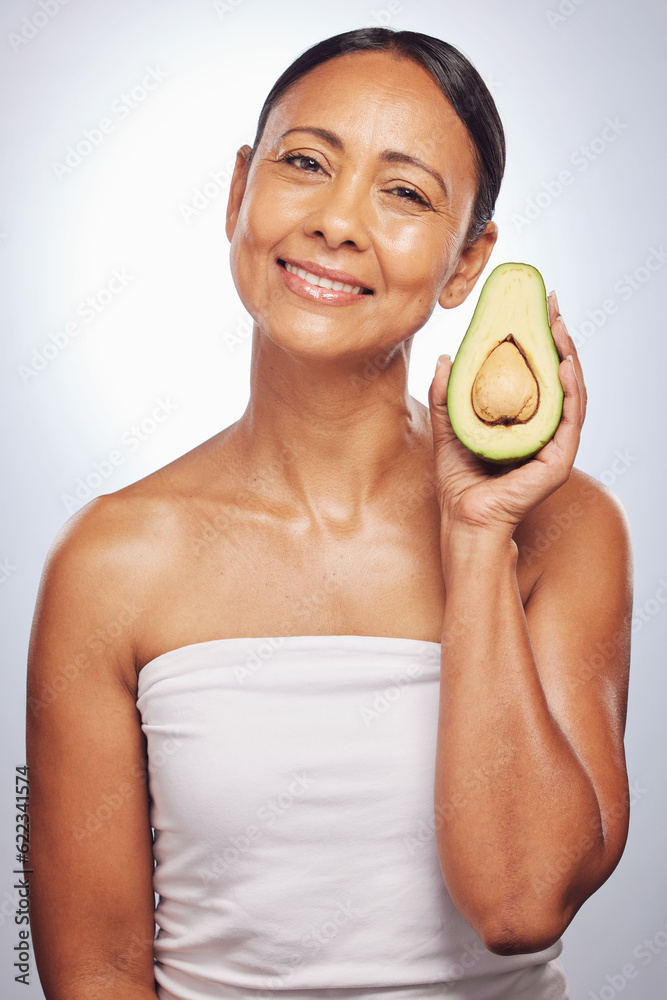 Skincare, portrait and senior woman with avocado in studio isolated on a white background. Face, nat