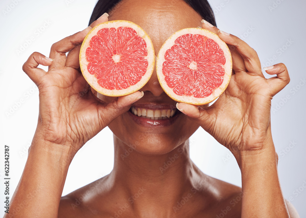 Smile, face and senior woman with grapefruit in studio isolated on a white background. Skincare, nat