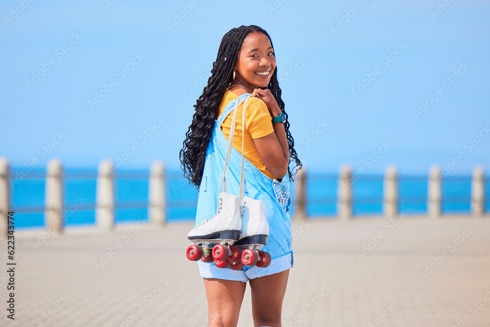 Portrait, back and roller skating with a black woman by the sea, on the promenade for training or re