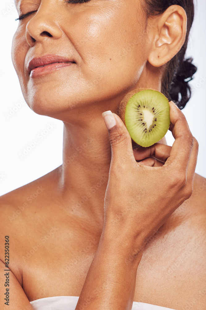 Skincare, beauty and senior woman with kiwi in studio isolated on a transparent png background. Food