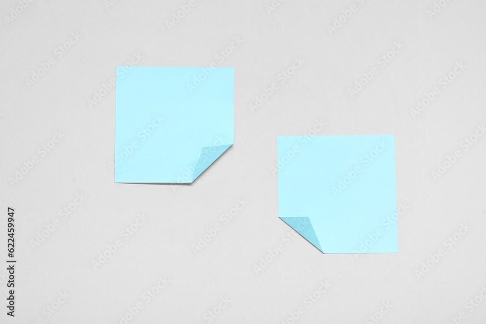 Blue sticky notes on grey background