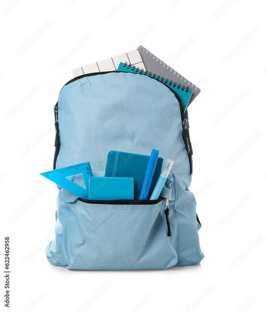 Blue school backpack with notebooks, markers and set square on white background