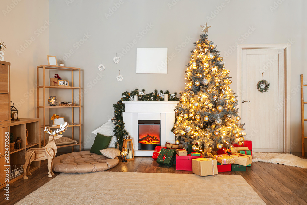 Interior of living room with fireplace, Christmas tree and gifts