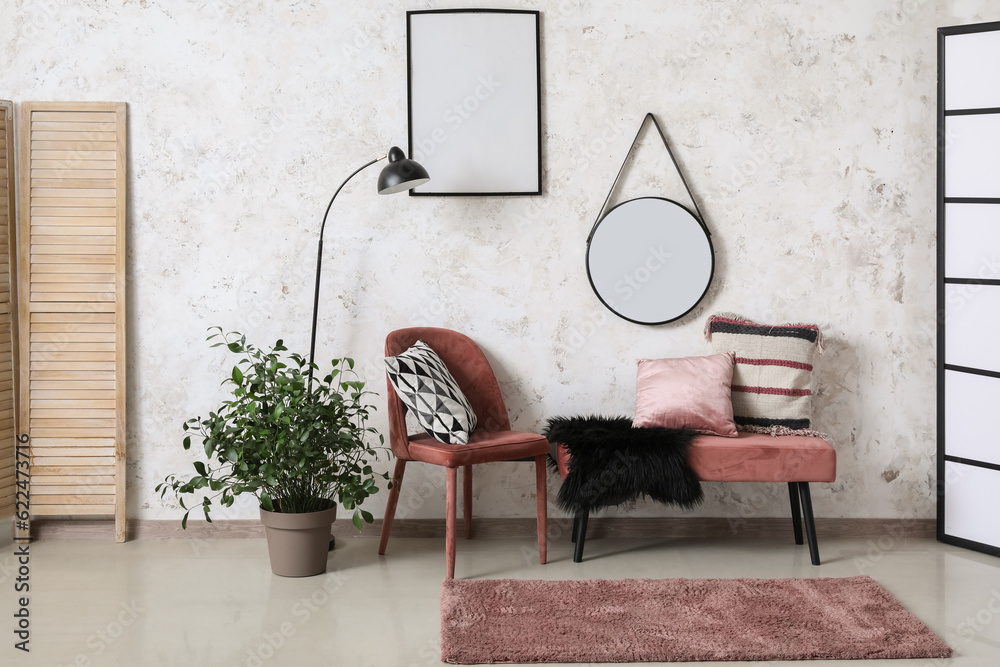 Interior of living room with chair, bench and mirror