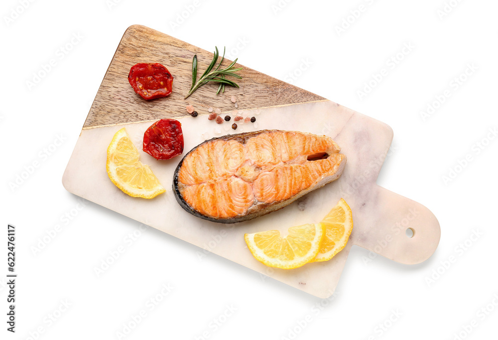 Board with tasty grilled salmon steak on white background