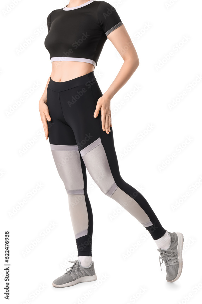 Young woman in sportswear on white background