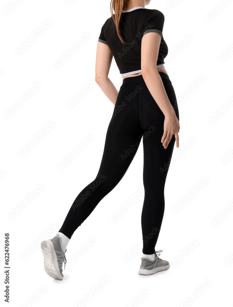 Young woman in sportswear on white background