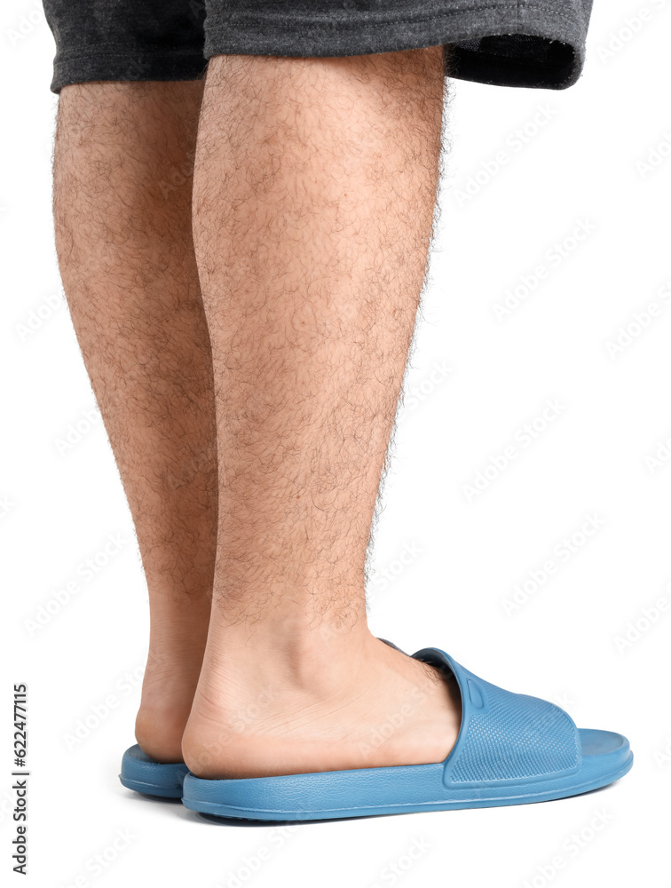 Male legs in flip-flops on white background