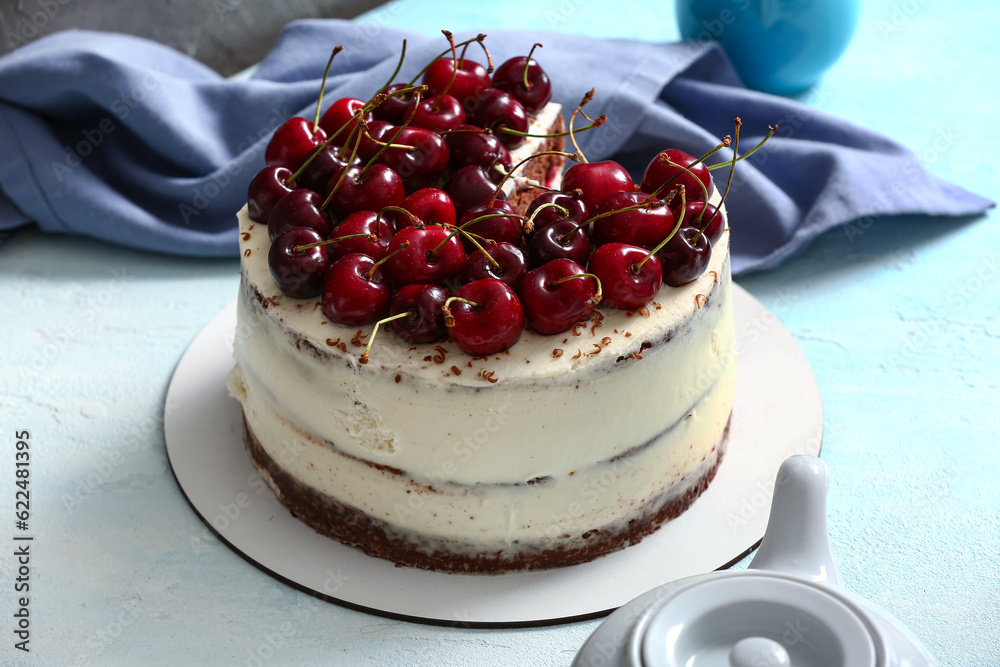 Tasty cherry cake on light background