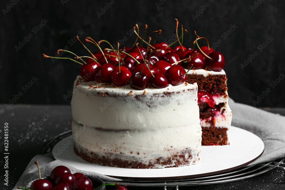 Tasty cherry cake on table