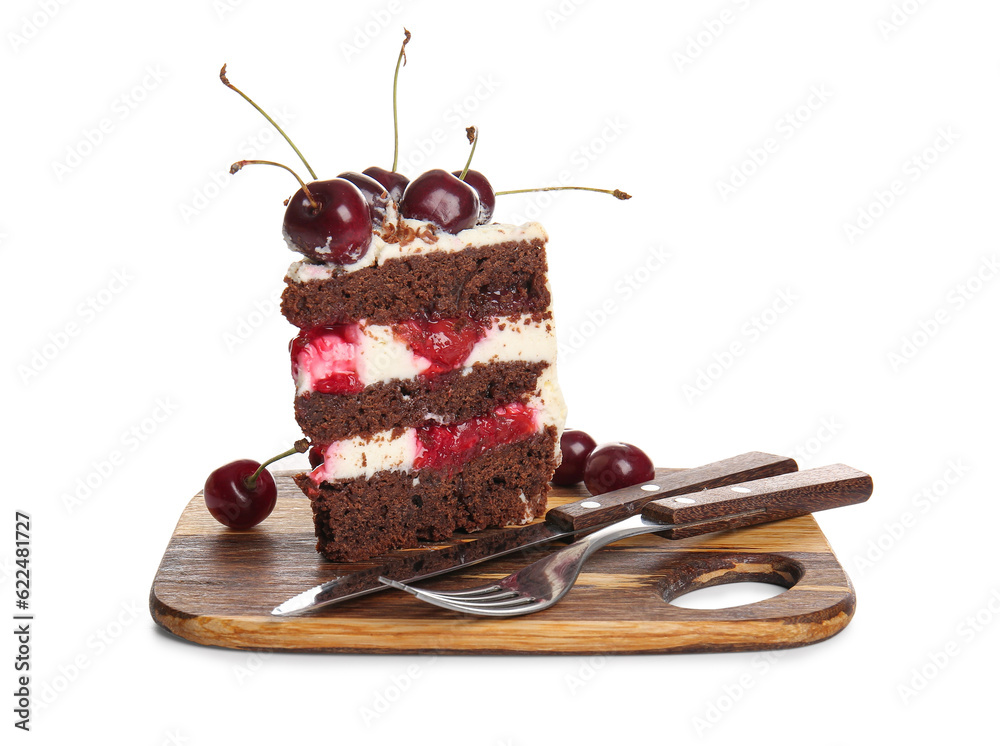 Wooden board with piece of tasty cherry cake isolated on white background