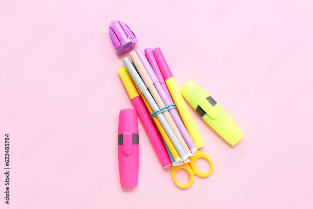 Stationery in shape of rocket on pink background