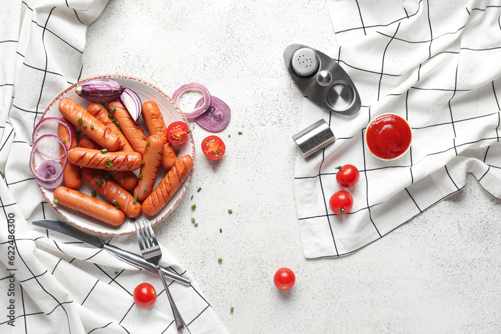 Plate with tasty grilled sausages on light background