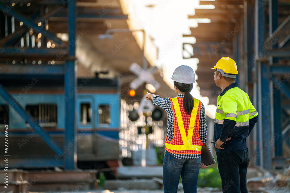 A team of engineers goes to the actual site as the train passes by to inspect and analyze the unfini