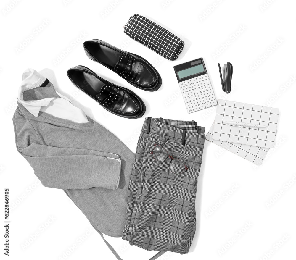 Composition with stylish school uniform, shoes and stationery on white background