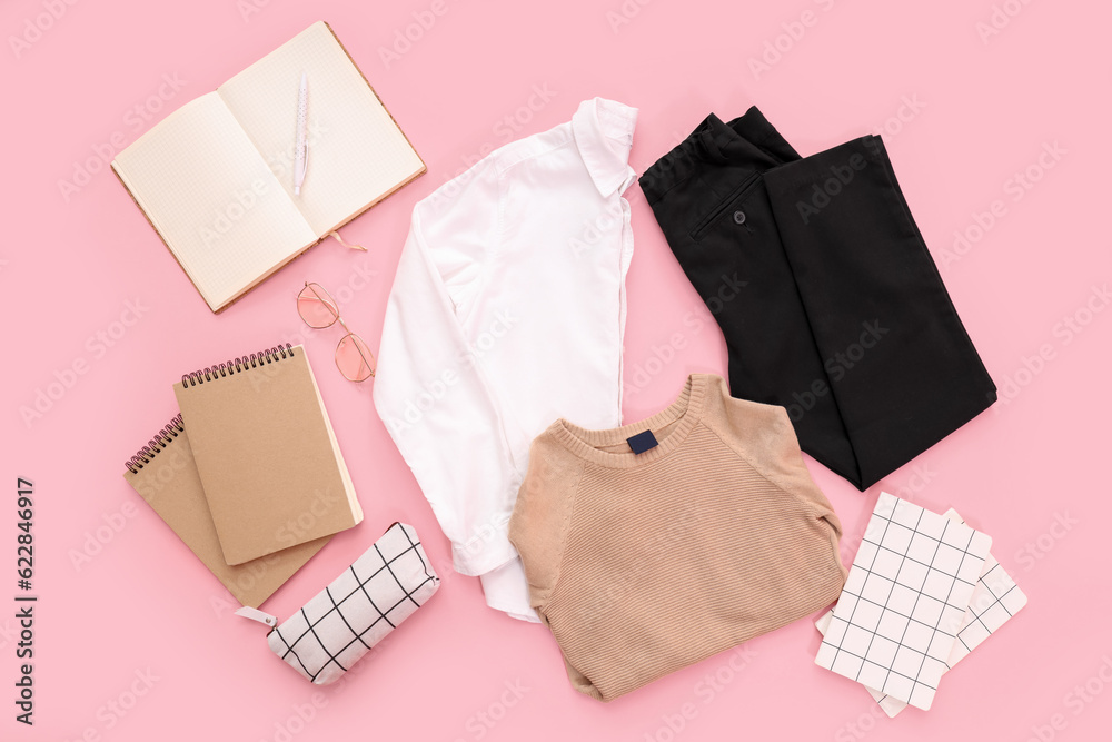 Composition with stylish school uniform, eyeglasses and notebooks on pink background