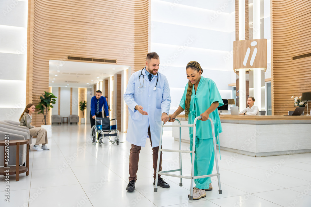 Caucasian doctors support patient walk through the hallway in hospital. 