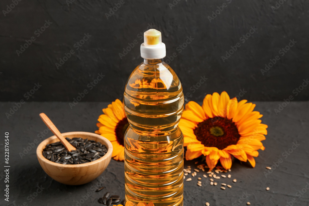 Bottle of sunflower oil on black background