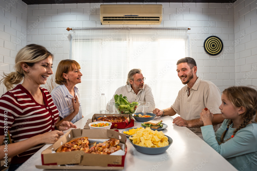 Caucasian lovely family having dinner, enjoying evening party in house. 