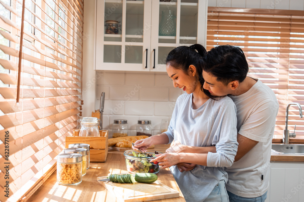 Asian young new marriage couple spend time together in kitchen at home. 