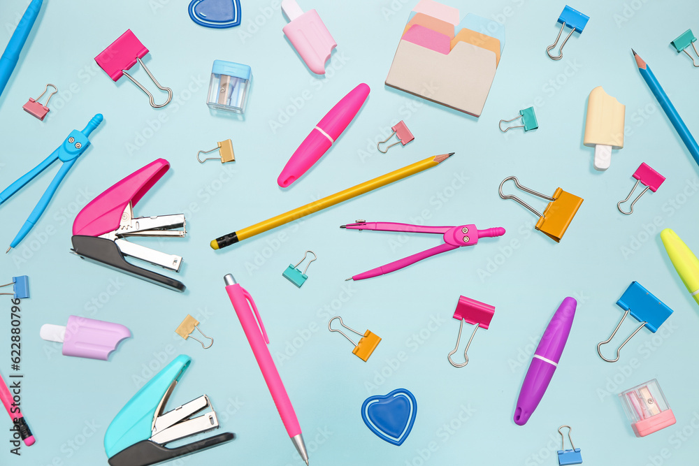 Many different stationery on blue background